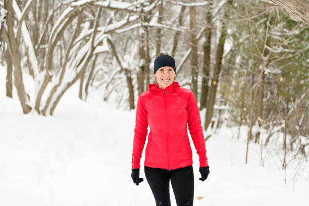 istock Blond woman running outdoors on a cold winter day 1080269286
