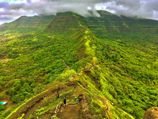 Tikona Fort Trekking Tikona fort trekking, mountain trekking, western ghat, pune. maharashtra stock pictures, royalty-free photos & images