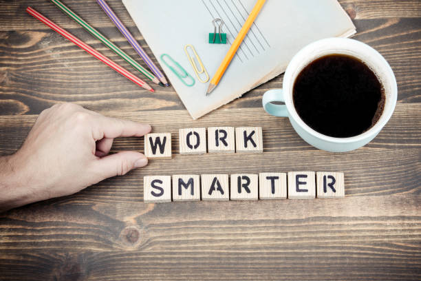 istock Work Smarter. Wooden letters on the office desk 1080274480