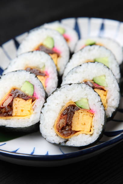istock thick roll of makizushi 1080274820