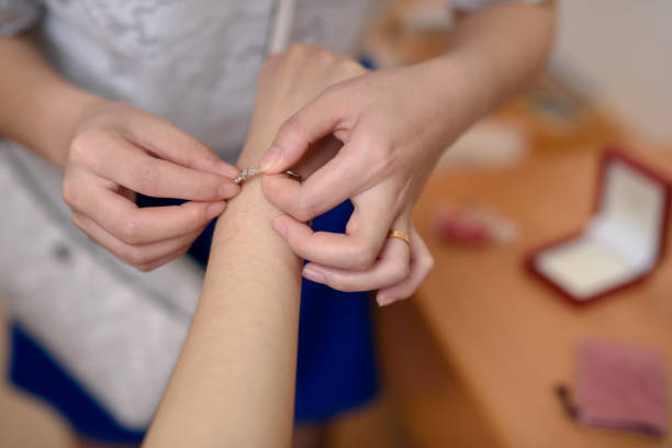 istock Elders putting on bracelet for brides 1080278942
