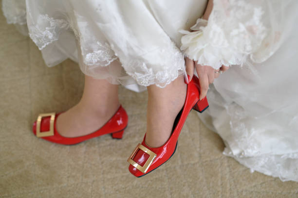 istock Brides wearing wedding shoe 1080279050