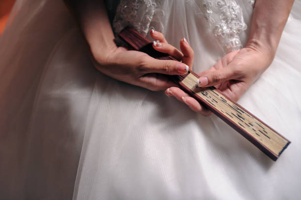 Happy young bride showing off wedding and engagement rings