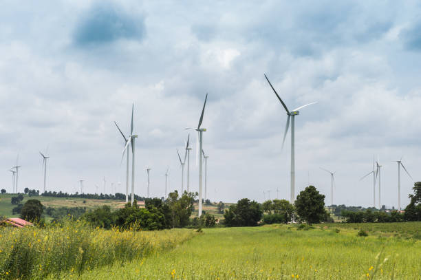 istock Wind Turbine Generator stands among farm landscape 1080283014