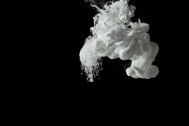 istock white paint splash flowing in water on black background 1080286002