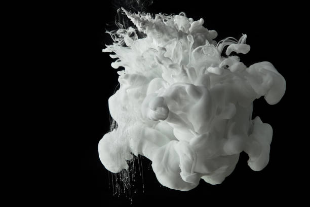 istock white splash of paint flowing in water on black background 1080286040