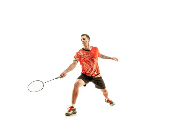 istock Young male badminton player over white background 1080292088