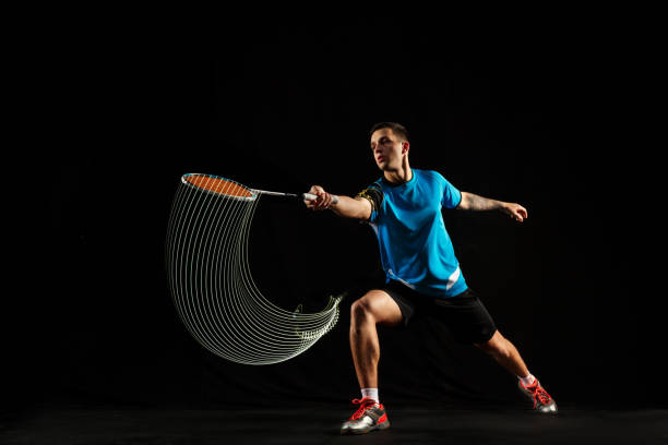 istock Young male badminton player over balck background 1080292120