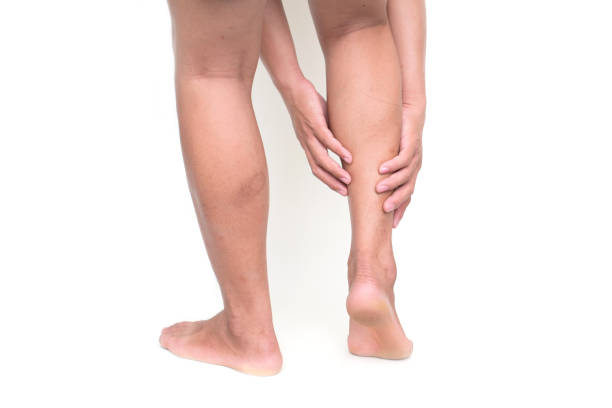 istock Young man suffering from pain in leg isolated on white background 1080292198