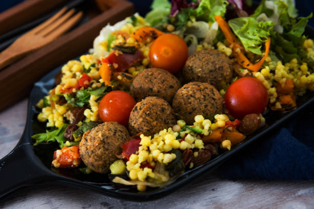 istock Kofta Tagine Moroccan Meatballs Served With Semolina and Vegetables 1080293426