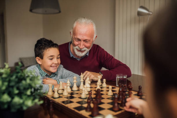 istock Family playing chess at home 1080294024