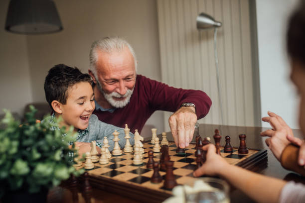 istock Jolly family playing chess 1080295542
