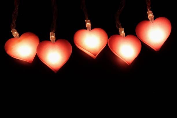 istock Heart shaped lamp on black background 1080295948