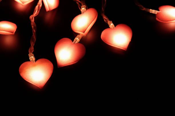 istock Heart shaped lamp on black background 1080296030