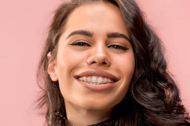 istock Beautiful young woman with teeth braces 1080296238