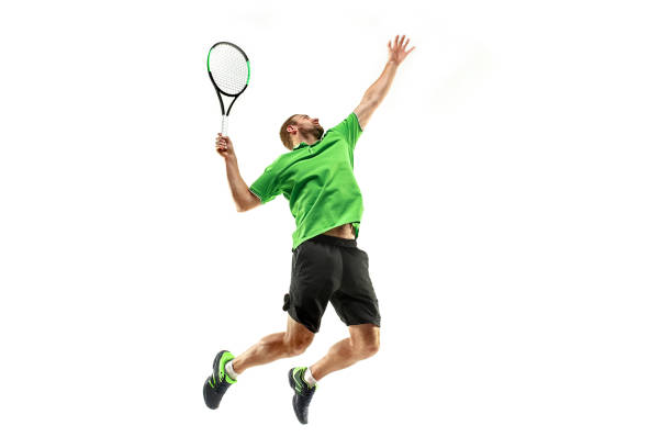 High jump. One young man, male professional tennis player in red uniform training isolated on white background. Concept of active life, team game, energy, sport, competition. Copy space for ad