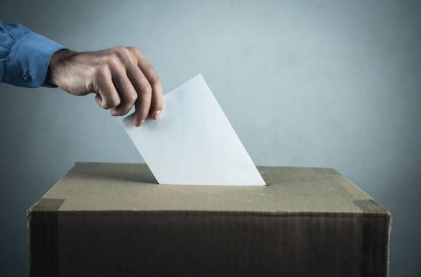 istock Voting at the ballot box. Election and democracy concept 1080298632