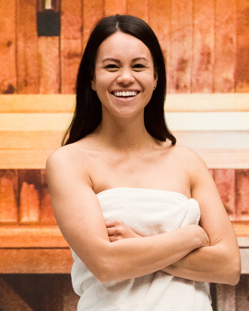 istock Beautiful female standing at the sauna 1080300158