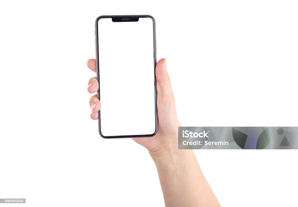 Smartphone with a blank white screen. New popular smartphone in hand on white background. Hand Stock Photo
