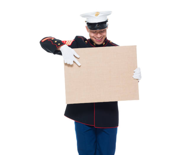 istock US Marine in uniform holding placard 1080305936