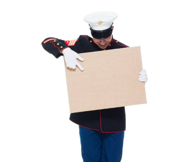 istock US Marine in uniform holding placard 1080305938