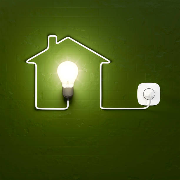 a light bulb building a house with the cable stock photo