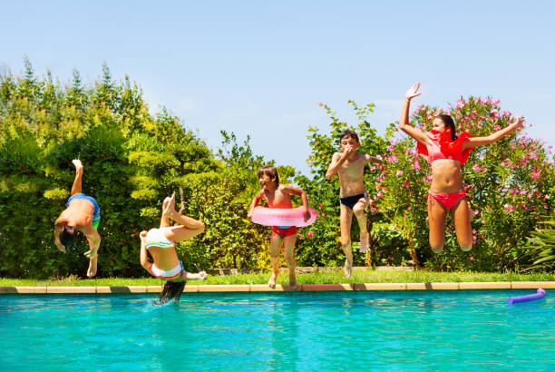 istock Kids playing pool games during backyard party 1080308778