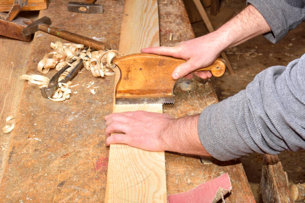 Carpenter with planer Carpenter with planer assiduity stock pictures, royalty-free photos & images