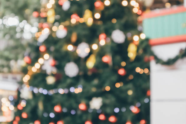 istock Abstract christmas holiday with festive gold bokeh light on tree blurred background 1080312758