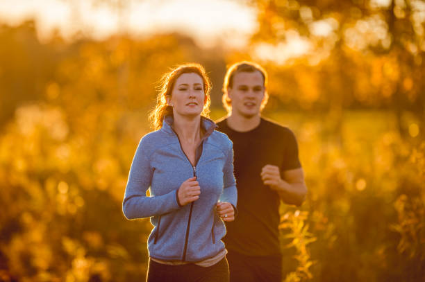 istock Couple running through the countryside 1080320426