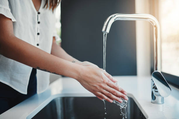 istock Washing her hands before she handles the food 1080320780