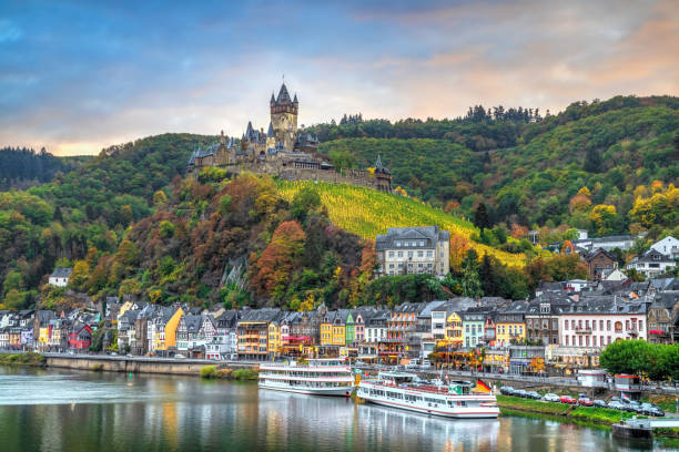 Cityscape of Cochem, Germany in Autumn Cochem, Germany - October 23 2018: Autumn cityscape with Moselle river, colorful houses on embankment and Cochem Castle rhineland palatinate photos stock pictures, royalty-free photos & images