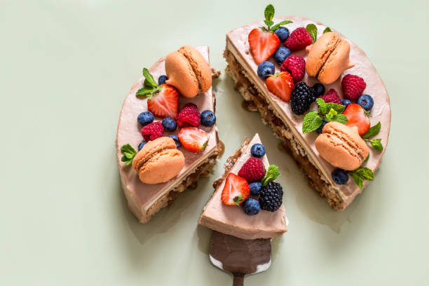 istock home-made cake with macaron and fresh fruit, berries on a light background 1080323388