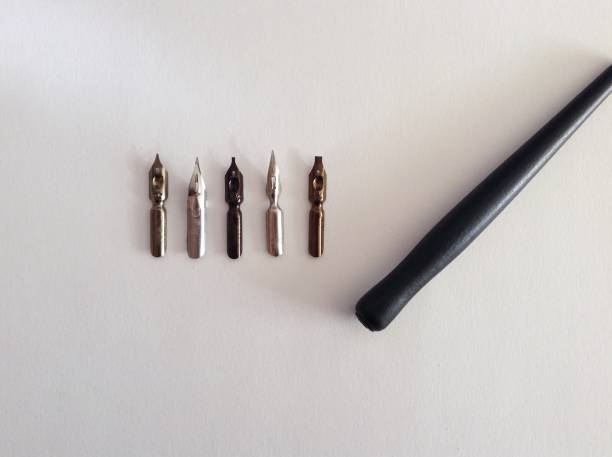calligraphy pens. calligraphy feathers and pen holder. flat lay top view