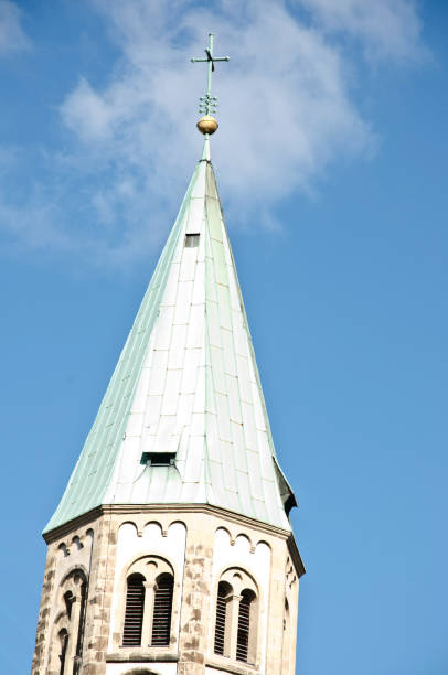 istock Church Cathedral (Catholic parish Herz-Jesu, Hörde - Dortmund, Germany) Tower. Blue sky background 1080329226