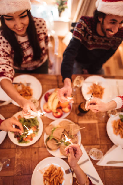 istock high angle view of friend at dinner for christmas 1080333872