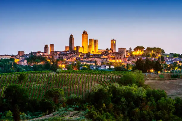 Photo of San Gimignano at dusk. Tuscany. Italy