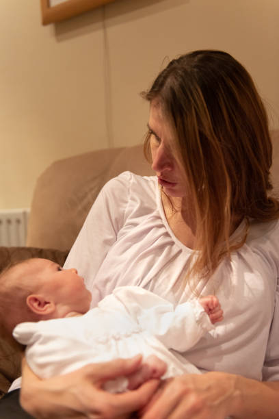 istock Mother looking at newborn 1080336654