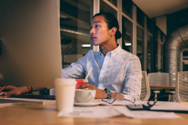 istock Businessman working late night in office 1080342556