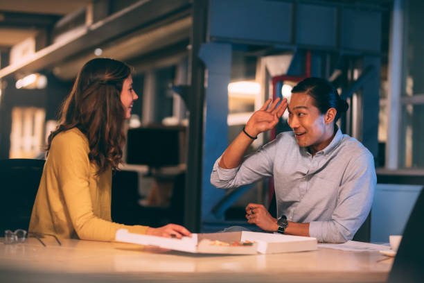 istock Smiling business people talking sitting in office 1080343930
