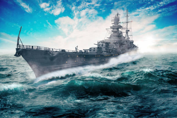 warship goes through the rough atlantic stock photo