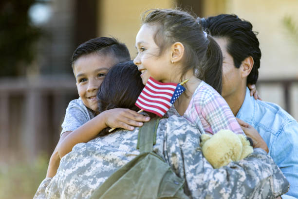 istock Young mom in uniform hugs her children 1080345438