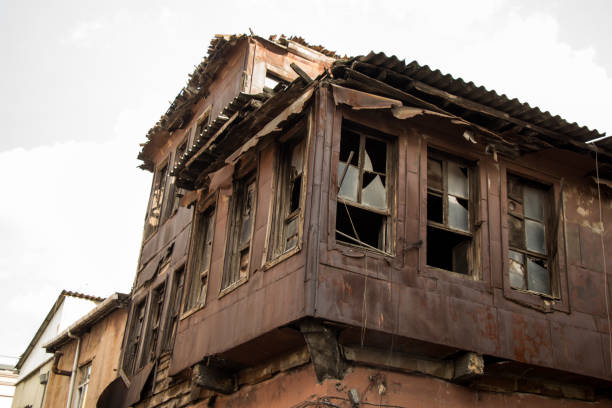 istock Ruined houses with broken windows on display 1080349918