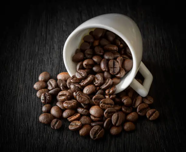 dark; espresso; black; bean; cafe; background; mug; caffeine; coffee; aroma; natural; drink; morning; style; breakfast; food; wooden; space; white; wood; brown; taste; old; closeup