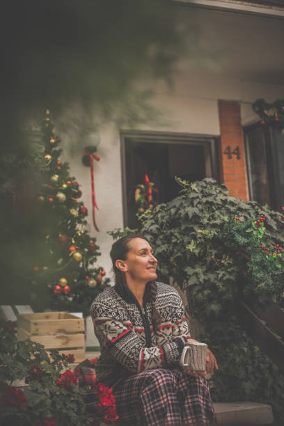 istock Woman drinking tea outdoors in Christmas time 1080355724