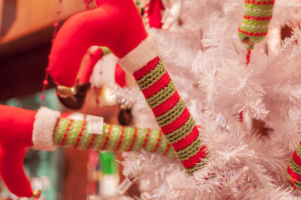 istock Elf Legs Sticking out of a Christmas Tree 1080356370