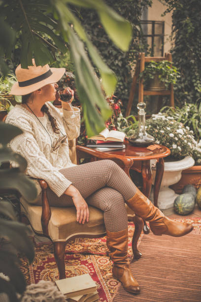istock Woman relaxing and drinking wine in back yard 1080357100