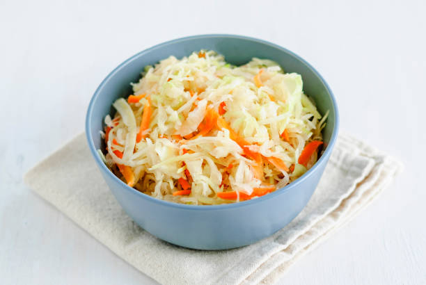istock Bowl with fermented cabbage on napkin 1080359044