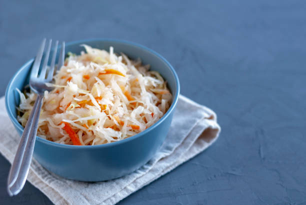 istock Bowl with sauerkraut standing on table 1080359116