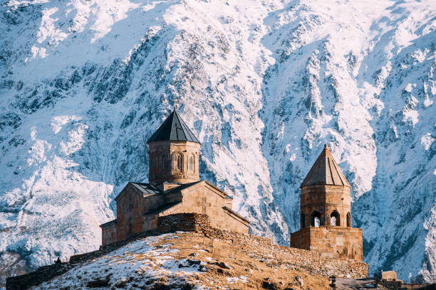 istock Stepantsminda, Georgia. Famous Gergeti Trinity Tsminda Sameba Church In Early Winter 1080359250